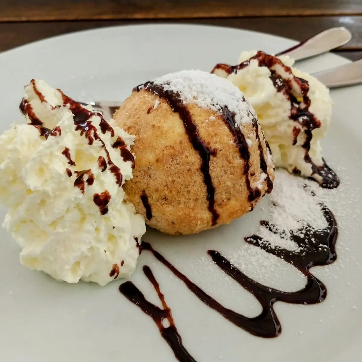 Sweet Cheese Dumplings in Breadcrumbs with Plum Compote