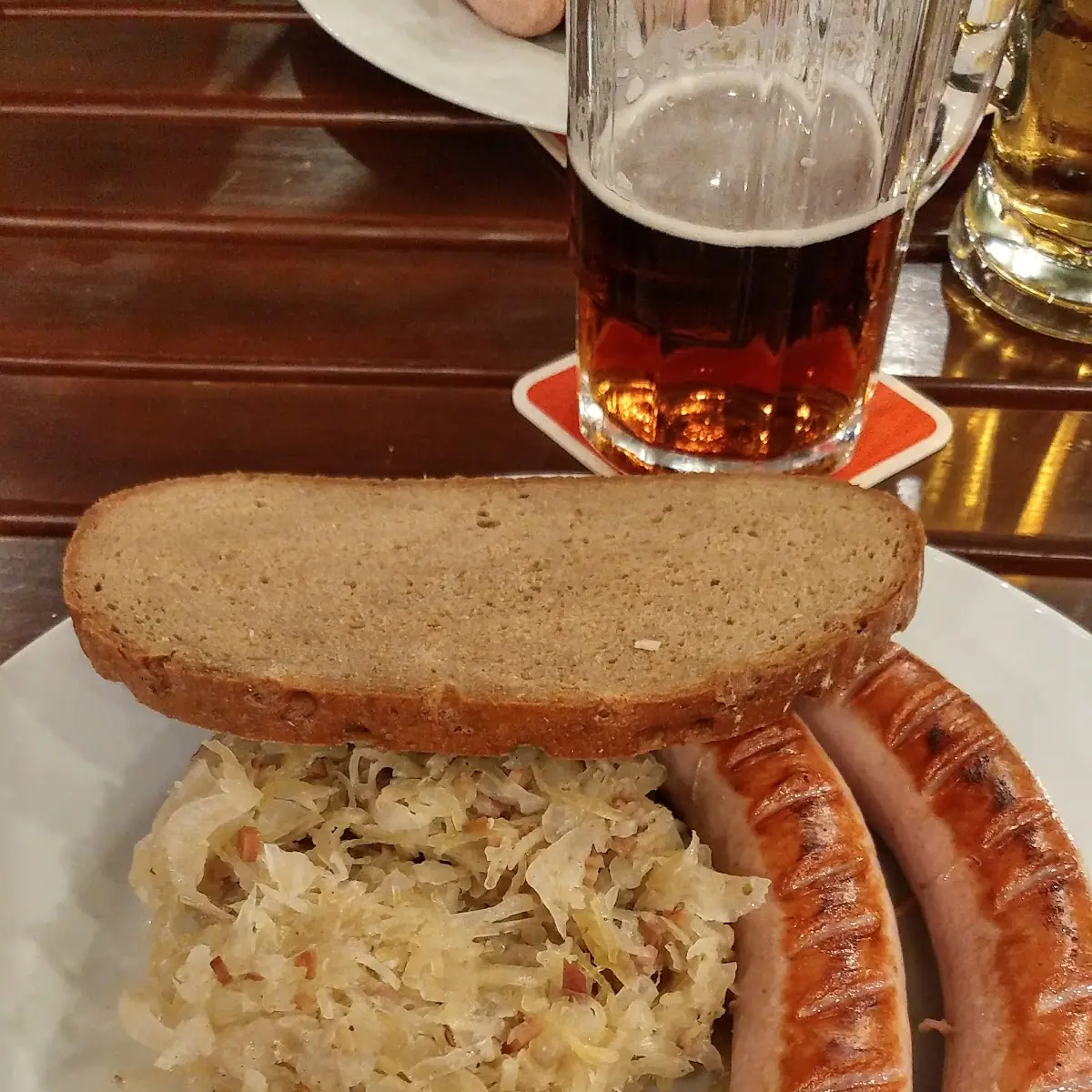 Grilled Sausage with Pickled Cabbage and Black Bread