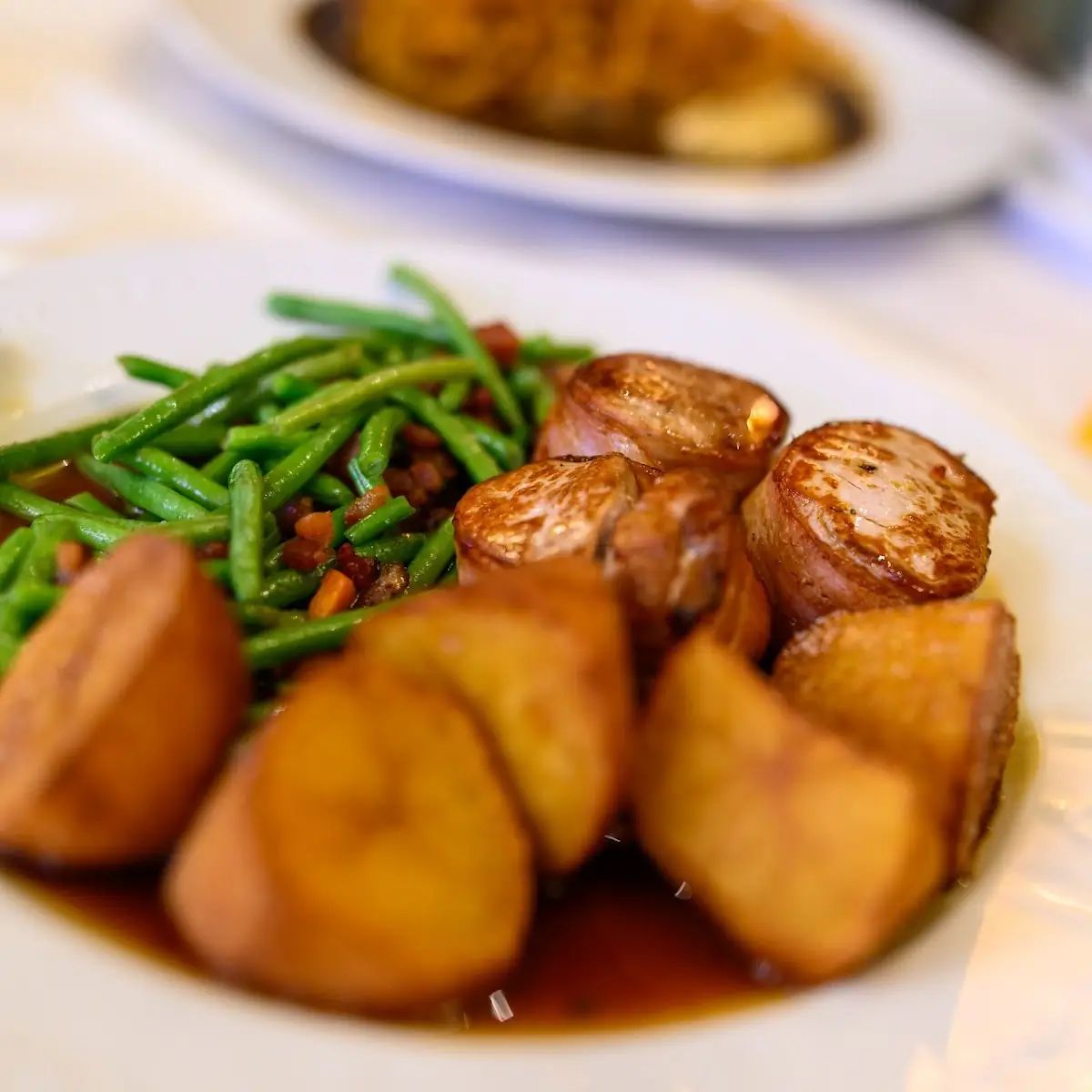 Medaillons of Porc with Garlic Sauce Fried Potatoes & Green Beans with Bacon