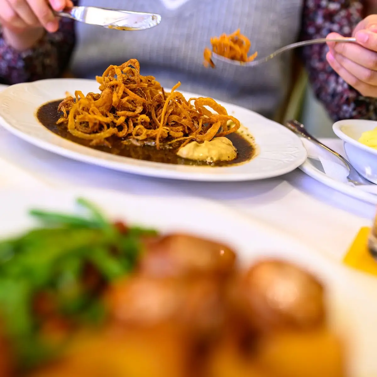 Zwiebelrostbraten Fried Beef And Onions In Gravy & Fried Potatoes