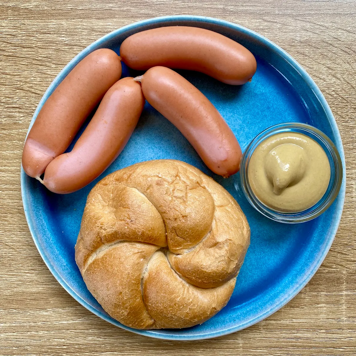 Frankfurter with Mustard and Piece of Roll
