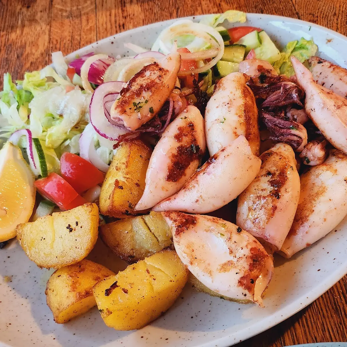 Wiener Schnitzel Mit Salat Grilled Calamari