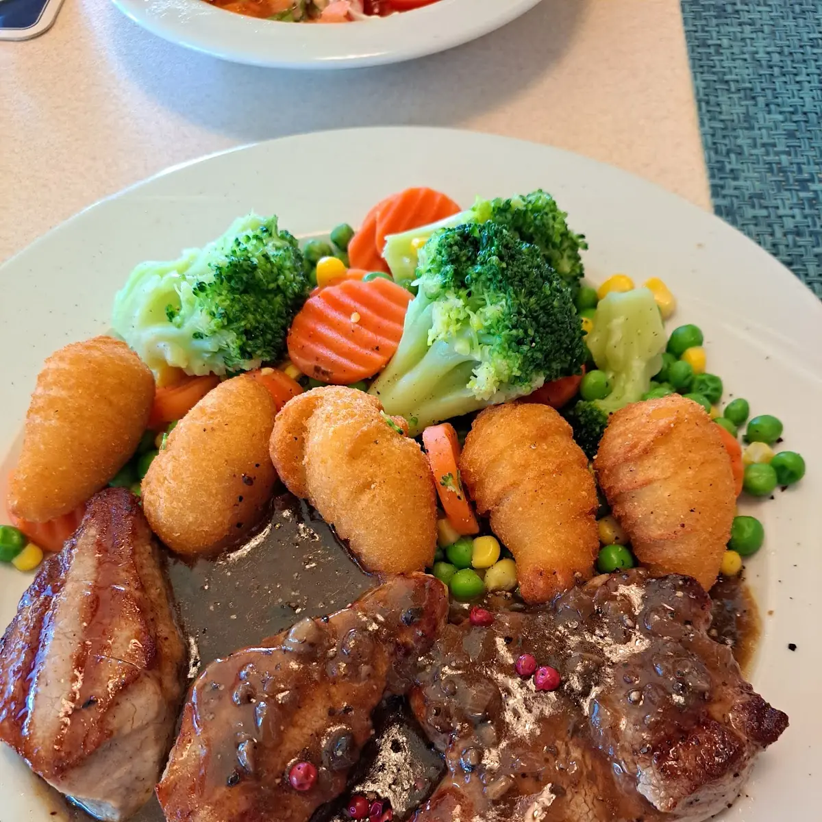 Schweins Medallions In Pfefferrahmsoße