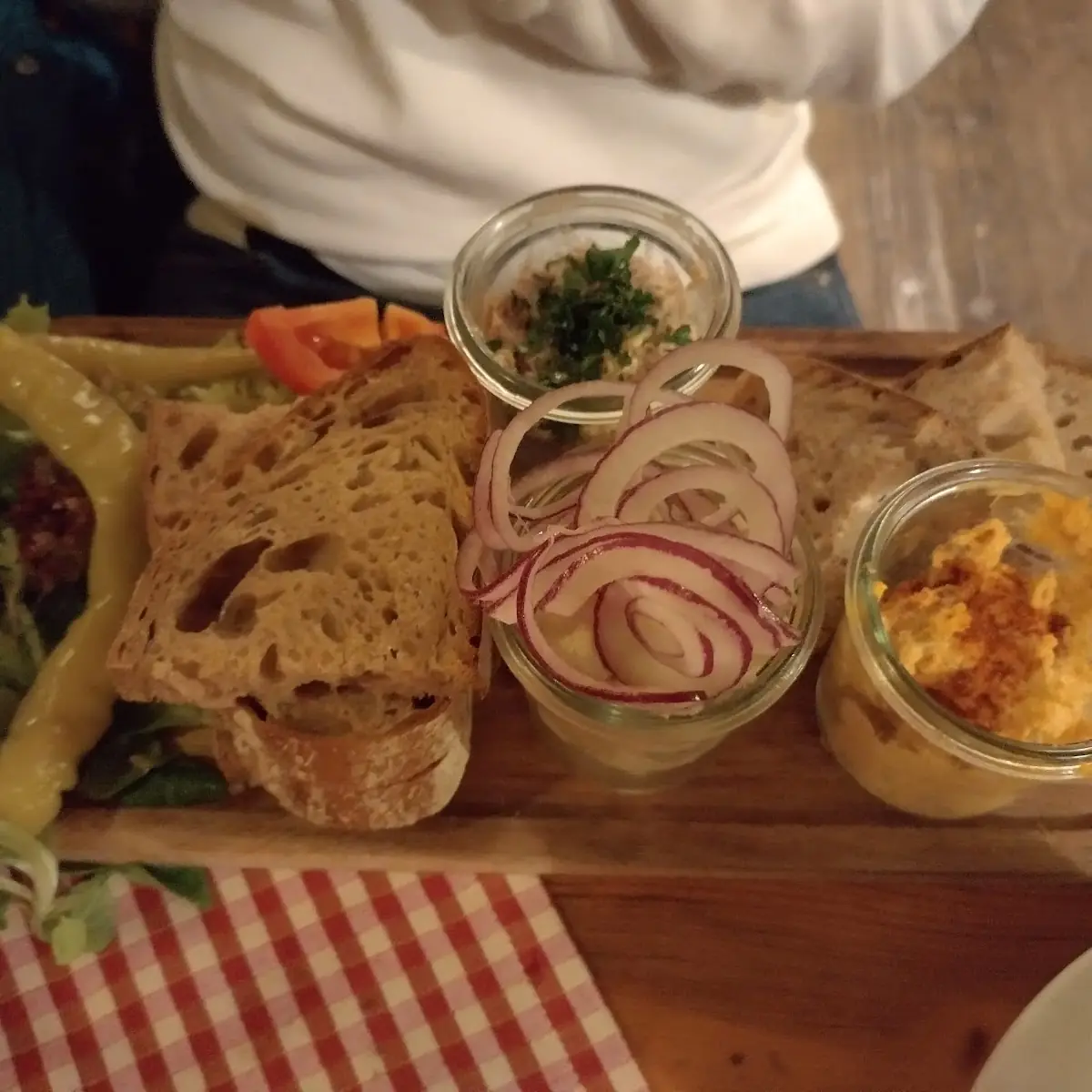 Various Heurigen Spreads Are Placed at the Tables with Bread