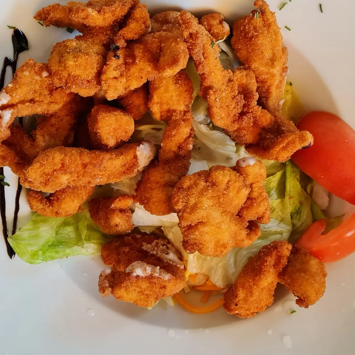 Putenstreifen Auf Salat Mit Kernöl