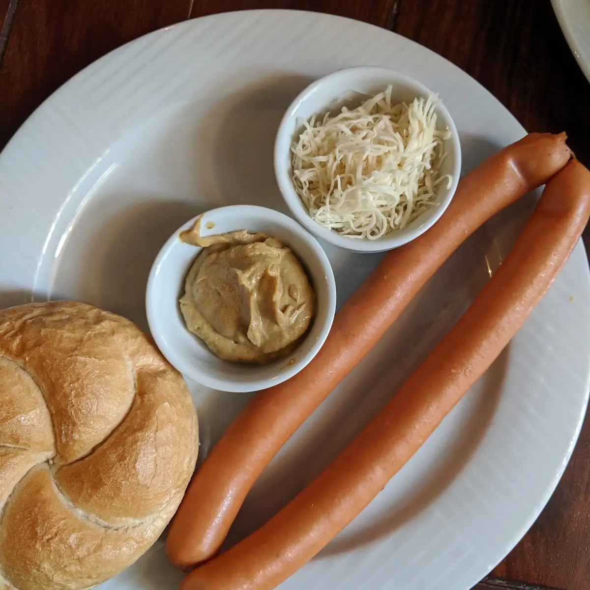 Viennese Sacher Sausages with Mustard and Horseradish Served with a Bread Roll