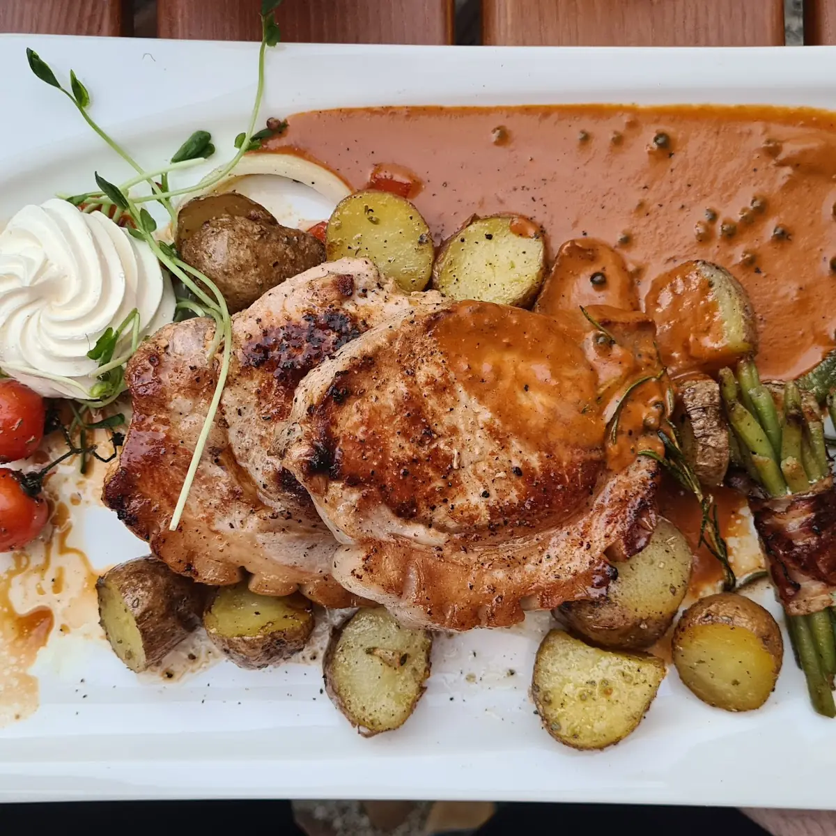 Pork-Backsteak on Green Pepper-Cognac-Creamsauce with Potatoes And