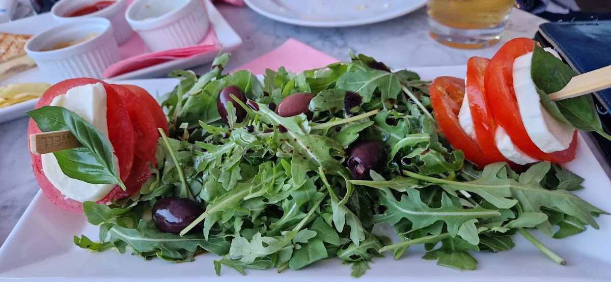 Salad with Mozzarella Tomato Arugula Olives Basil