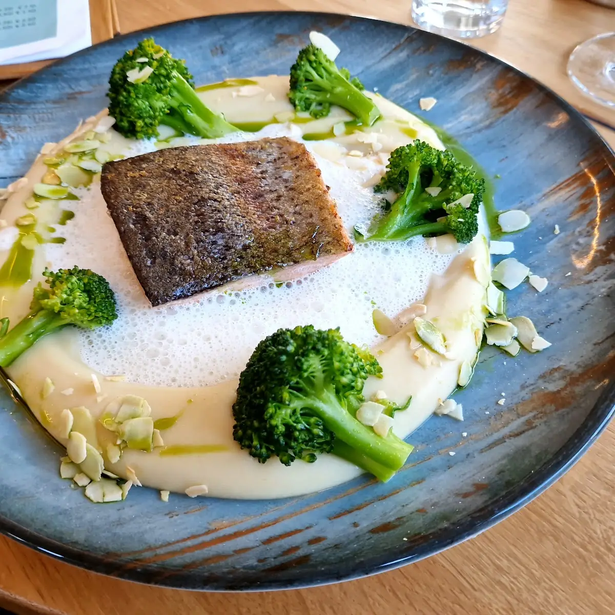 Salmon Steak with Celery Puree Broccoli Almonds and White Wine Foam
