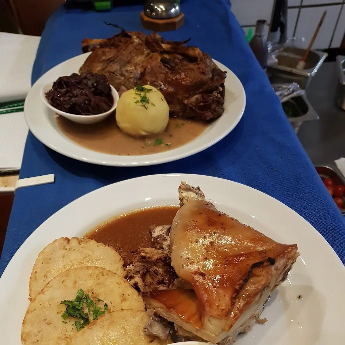 Roasted Pork Served with Bacon Pickled Cabbage and Bread Dumpling