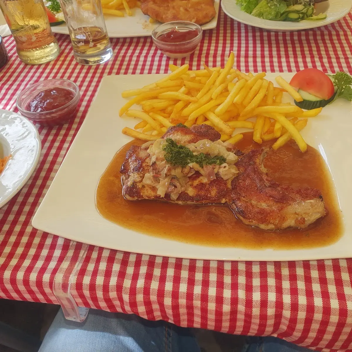 Grilled Cutlet of Pork with French Fries and Salat