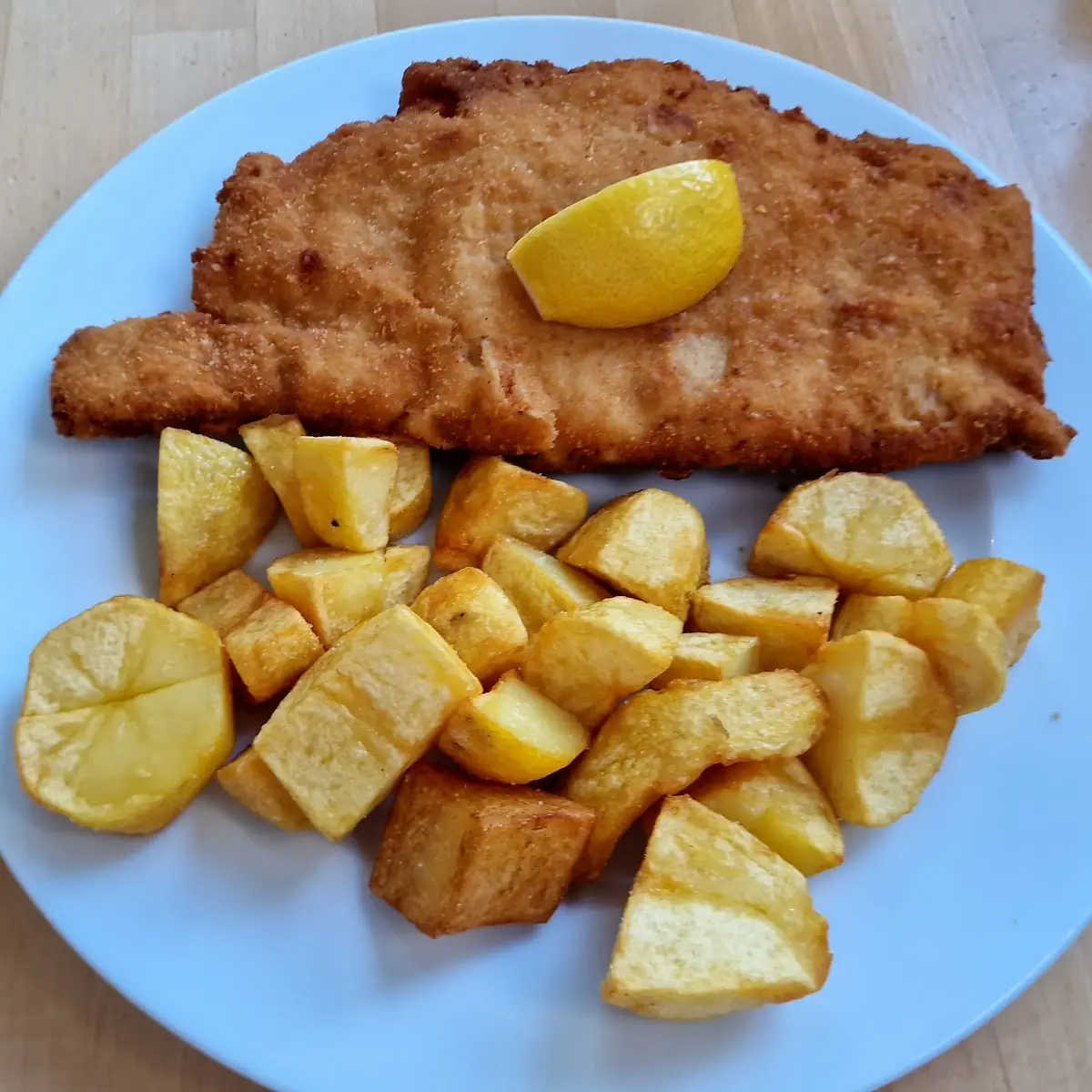 Pork Schnitzel with Potatoes Seasoned