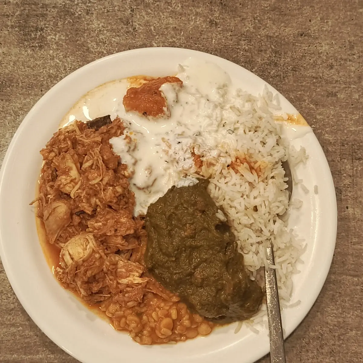 Buffet Mix Dish Including Rice Chicken Curry and Palak and Some Pulses