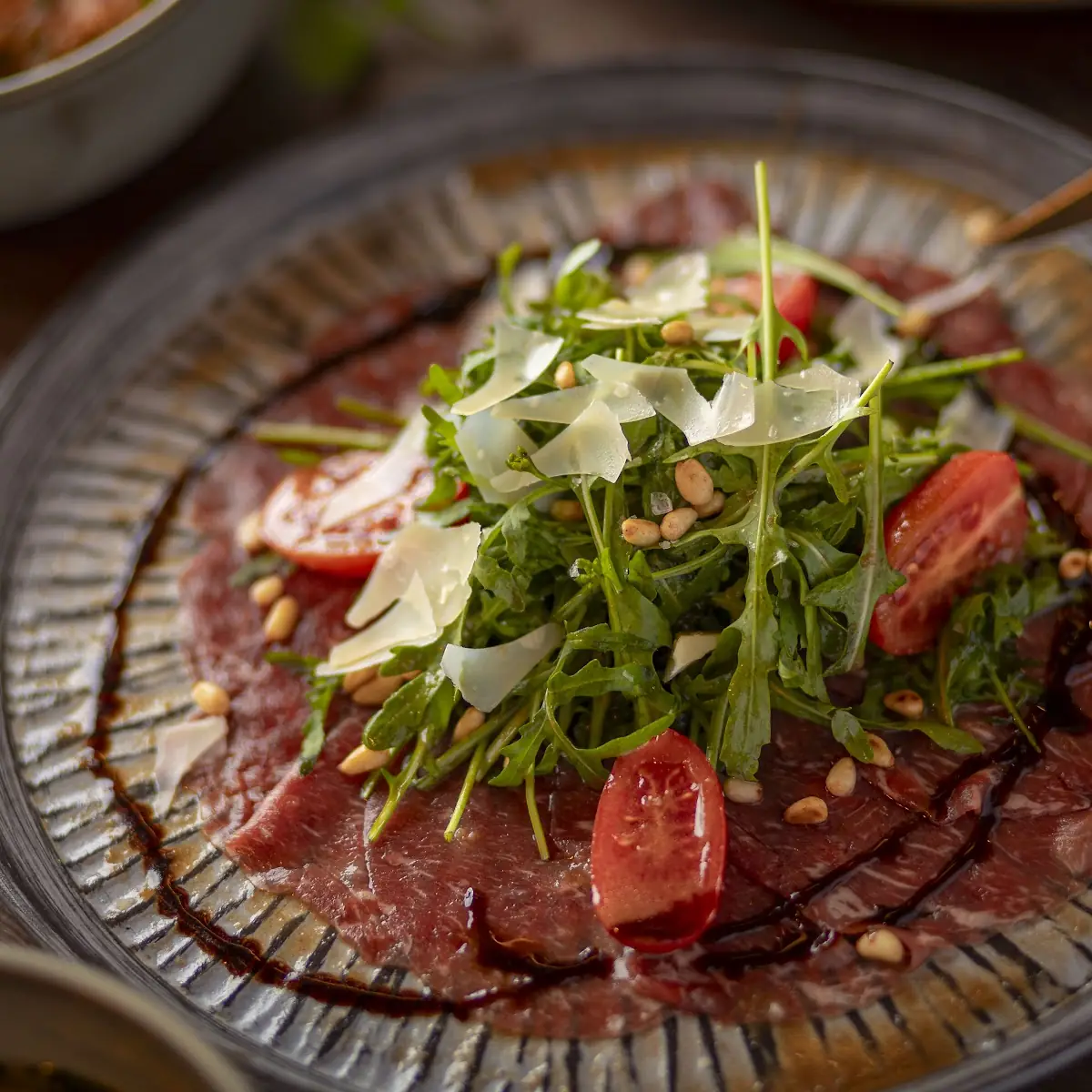 Carpaccio Vom Rind Mit Rucola Und Parmesansplitter