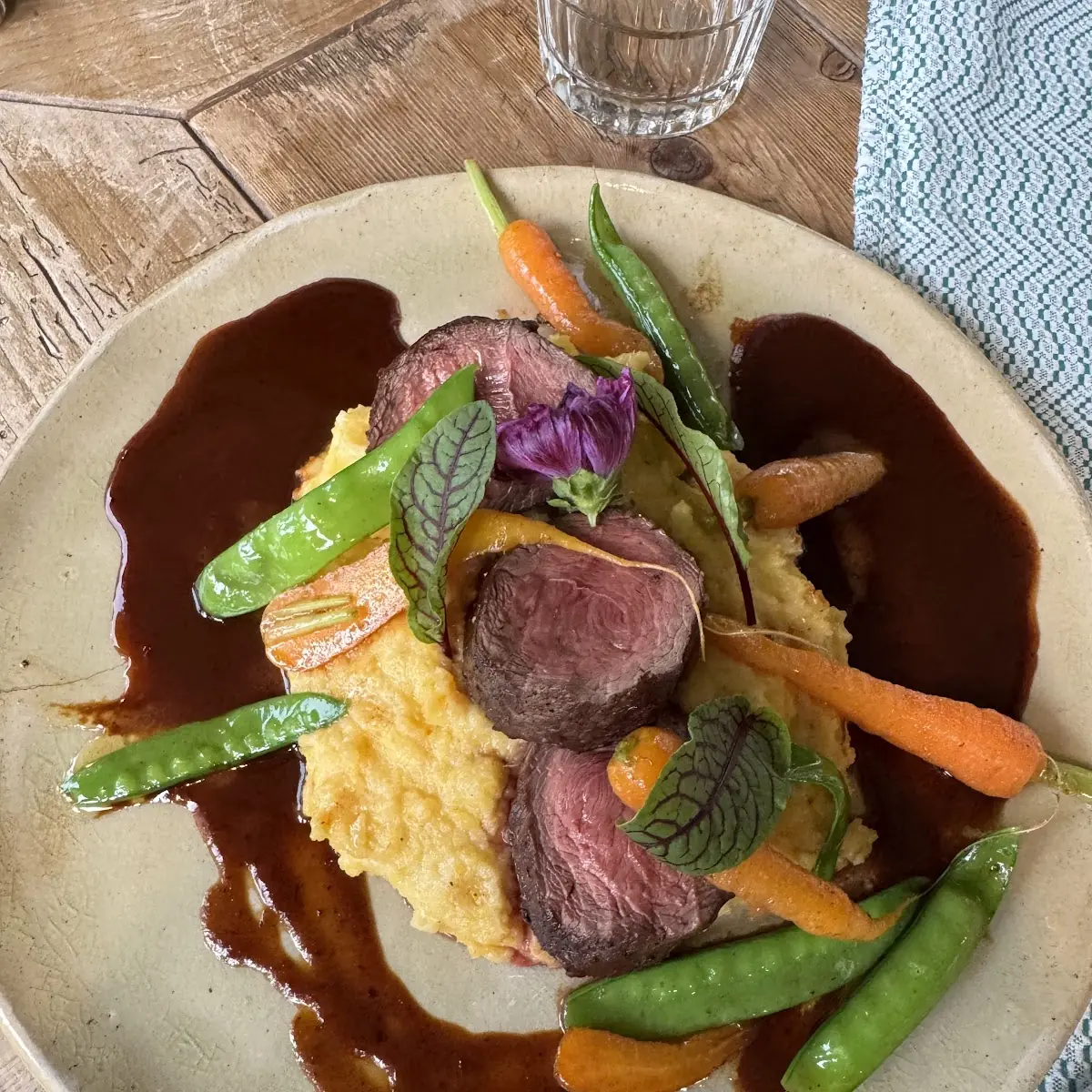 Leg of Venison with Black Nuts Apricots and Creamy Polenta