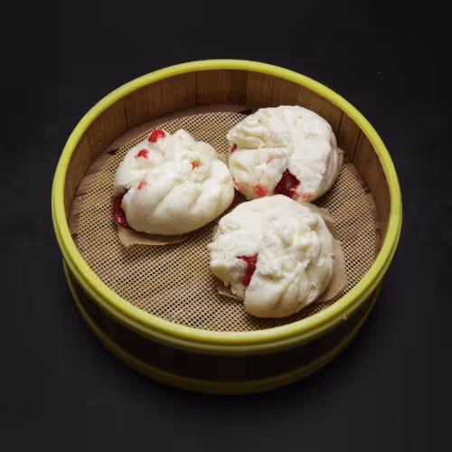 Gedämpfte Knödel mit gegrilltem Schweinefleisch
