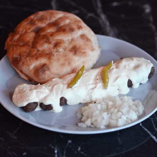 Cevapcici in Rahmsauce (10 Stück)