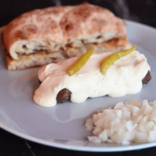 Cevapcici in Rahmsauce (5 Stück)